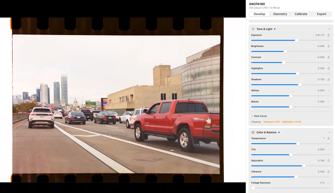 Film Scan Converter showing a developed film scan of city traffic beside exposure and color controls